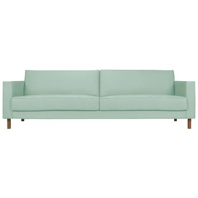 sofá verde claro com pés de madeira